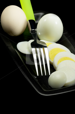 To use this stock image in your creative project, please select the size you need over to the right and click the "Add to Cart" button.
Your downloaded image will come with the Cutcaster watermark removed so don’t worry about the watermark you see on this page. Boiled eggs stock photo, Fresh boiled eggs one whole ,one peeled and another sliced on a black plate with fork by Francesco Perre