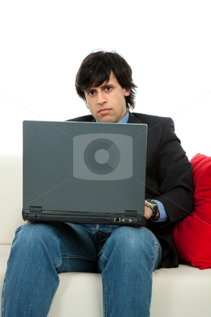 To use this stock image in your creative project, please select the size you need over to the right and click the "Add to Cart" button.
Your downloaded image will come with the Cutcaster watermark removed so don’t worry about the watermark you see on this page. Working stock photo, Young man working with laptop in a couch by Rui Vale de Sousa