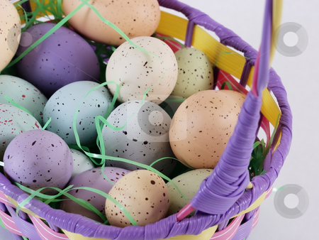 To use this stock image in your creative project, please select the size you need over to the right and click the "Add to Cart" button.
Your downloaded image will come with the Cutcaster watermark removed so don’t worry about the watermark you see on this page. Easter Eggs in a basket stock photo, Multi colored pastel speckled eggs in an Easter basket with Easter grass. by Robert Gebbie
