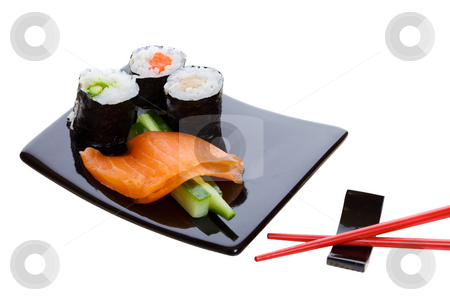 To use this stock image in your creative project, please select the size you need over to the right and click the "Add to Cart" button.
Your downloaded image will come with the Cutcaster watermark removed so don’t worry about the watermark you see on this page. Sushi platter stock photo, Sushi dish on a white background with red chopsticks by Steve Mcsweeny