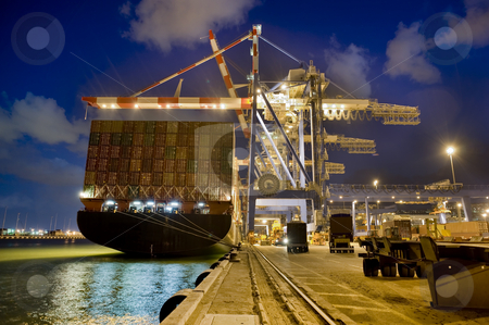 Cargo ship by night Cargo ship by night stock photo, Cargo ship at dock by night from behind by Noam Armonn