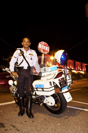 To use this stock image in your creative project, please select the size you need over to the right and click the "Add to Cart" button.
Your downloaded image will come with the Cutcaster watermark removed so don’t worry about the watermark you see on this page. Police man in Malacca stock photo, Police man, policeman, bike, night, police, Malacca, Malaysia by Jimme Woudstra
