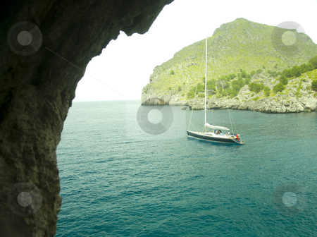To use this stock image in your creative project, please select the size you need over to the right and click the "Add to Cart" button.
Your downloaded image will come with the Cutcaster watermark removed so don’t worry about the watermark you see on this page. Mallorca stock photo, Sailing boat in a lonley ocean bay in mallorca spain by Wolfgang Zintl