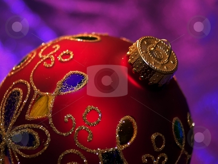 To use this stock image in your creative project, please select the size you need over to the right and click the "Add to Cart" button.
Your downloaded image will come with the Cutcaster watermark removed so don’t worry about the watermark you see on this page. Shiny red Christmas ornament with glitter stock photo, Round Christmas tree decoration with swirls of gold glitter. by Michelle White