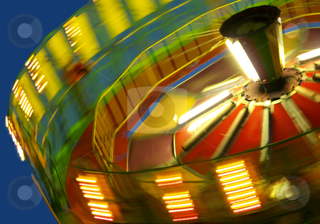 To use this stock image in your creative project, please select the size you need over to the right and click the "Add to Cart" button.
Your downloaded image will come with the Cutcaster watermark removed so don’t worry about the watermark you see on this page. Abstract Canival Ride stock photo, Blurred motion of a spinning ride at the fair by Michelle White
