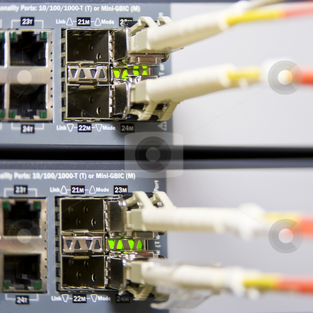 To use this stock image in your creative project, please select the size you need over to the right and click the "Add to Cart" button.
Your downloaded image will come with the Cutcaster watermark removed so don’t worry about the watermark you see on this page. Fiber optics stock photo, Fiber optics connectors on an internet server by Corepics VOF