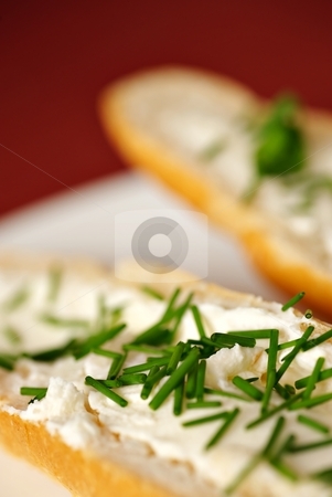To use this stock image in your creative project, please select the size you need over to the right and click the "Add to Cart" button.
Your downloaded image will come with the Cutcaster watermark removed so don’t worry about the watermark you see on this page. Big detail of bread roll with chives vertical stock photo, Close up detail of bread roll with cheese and chives, shallow DOF, red - purple background, white plate, vertical composition by Juraj Kovacik