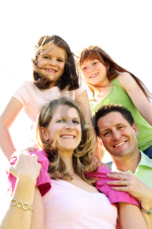 Happy family Happy family stock photo, Portrait of happy family giving children shoulder rides by Elena Elisseeva