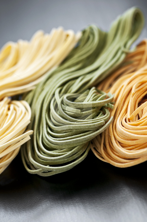 Tagliolini pasta Tagliolini pasta stock photo, Assorted bundles of colorful raw tagliolini pasta noodles by Elena Elisseeva