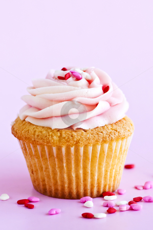 Cupcake Cupcake stock photo, Single cupcake with pink icing and sprinkles by Elena Elisseeva