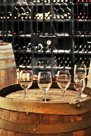 To use this stock image in your creative project, please select the size you need over to the right and click the "Add to Cart" button.
Your downloaded image will come with the Cutcaster watermark removed so don’t worry about the watermark you see on this page. Wine glasses and barrels stock photo, Row of wine glasses on barrel in winery cellar by Elena Elisseeva