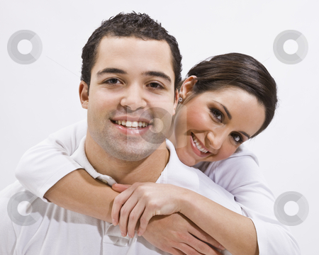 To use this stock image in your creative project, please select the size you need over to the right and click the "Add to Cart" button.
Your downloaded image will come with the Cutcaster watermark removed so don’t worry about the watermark you see on this page. Attractive Young Couple Posing stock photo, An attractive young couple posing together. The female has her arms around the male's neck. They are smiling directly at the camera. Horizontally framed shot. by Jonathan Ross