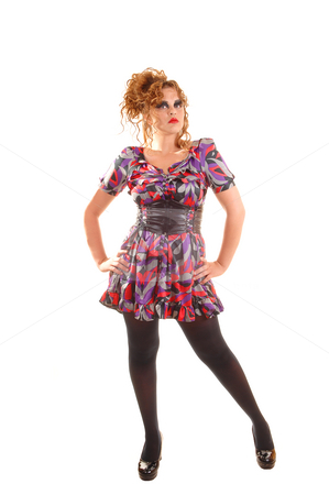 To use this stock image in your creative project, please select the size you need over to the right and click the "Add to Cart" button.
Your downloaded image will come with the Cutcaster watermark removed so don’t worry about the watermark you see on this page. Pretty modern woman. stock photo, Beautiful red haired woman in a colorful dress with a big belt, black
pantyhose and high heels standing in the studio wit her hands on the hips. by Horst Petzold