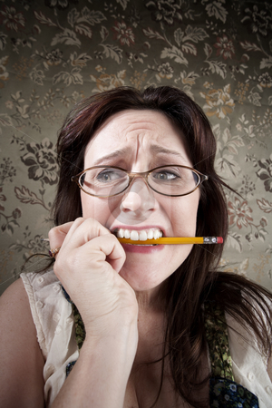 To use this stock image in your creative project, please select the size you need over to the right and click the "Add to Cart" button.
Your downloaded image will come with the Cutcaster watermark removed so don’t worry about the watermark you see on this page. Nervous Woman Chewing on a Pencil stock photo, Nervous Brunette Woman Chewing on Yellow Pencil by Scott Griessel
