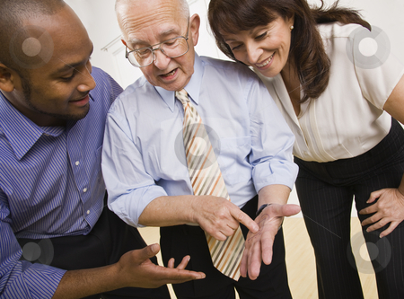 To use this stock image in your creative project, please select the size you need over to the right and click the "Add to Cart" button.
Your downloaded image will come with the Cutcaster watermark removed so don’t worry about the watermark you see on this page. Business People Working in Office stock photo, A group of business people are working together in an office. They are talking to each other and looking away from the camera. Horizontally framed shot. by Jonathan Ross