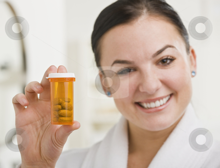 To use this stock image in your creative project, please select the size you need over to the right and click the "Add to Cart" button.
Your downloaded image will come with the Cutcaster watermark removed so don’t worry about the watermark you see on this page. Woman Holding up Medication stock photo, A woman is holding up a bottle of prescription medication and smiling at the camera. Horizontally framed shot. by Jonathan Ross