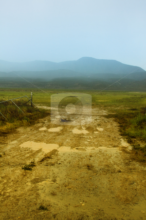 To use this stock image in your creative project, please select the size you need over to the right and click the "Add to Cart" button.
Your downloaded image will come with the Cutcaster watermark removed so don’t worry about the watermark you see on this page. Dirt Road to the Mountains stock photo, Dirt Road to the Mountains in a foggy weather by Mehmet Dilsiz