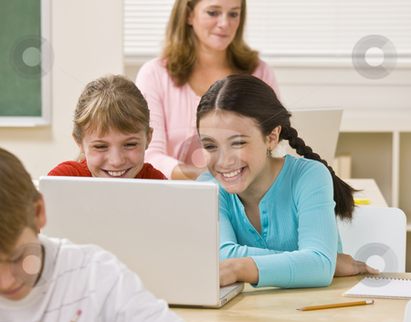 To use this stock image in your creative project, please select the size you need over to the right and click the "Add to Cart" button.
Your downloaded image will come with the Cutcaster watermark removed so don’t worry about the watermark you see on this page. Girls using laptop in classroom stock photo, Girls using laptop in classroom by Jonathan Ross