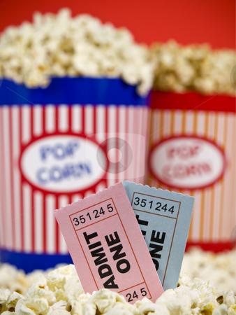 To use this stock image in your creative project, please select the size you need over to the right and click the "Add to Cart" button.
Your downloaded image will come with the Cutcaster watermark removed so don’t worry about the watermark you see on this page. Tickets and fun stock photo, Two popcorn buckets over a red background. Movie stubs sitting over the popcorn. by Ignacio Gonzalez Prado