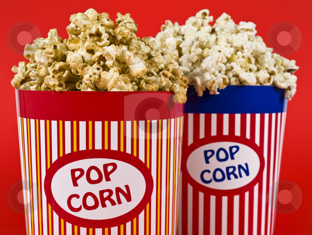 To use this stock image in your creative project, please select the size you need over to the right and click the "Add to Cart" button.
Your downloaded image will come with the Cutcaster watermark removed so don’t worry about the watermark you see on this page. Two popcorn buckets stock photo, Two popcorn buckets over a red background. by Ignacio Gonzalez Prado