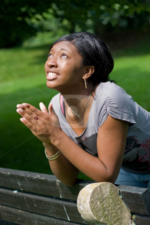 To use this stock image in your creative project, please select the size you need over to the right and click the "Add to Cart" button.
Your downloaded image will come with the Cutcaster watermark removed so don’t worry about the watermark you see on this page. Young Woman Praying stock photo, A young woman praying with her hands together. by Todd Arena
