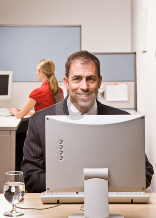 To use this stock image in your creative project, please select the size you need over to the right and click the "Add to Cart" button.
Your downloaded image will come with the Cutcaster watermark removed so don’t worry about the watermark you see on this page. Businessman typing on computer at desk stock photo, Businessman typing on computer at desk by Jonathan Ross