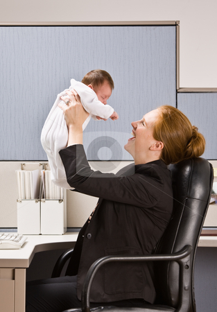 To use this stock image in your creative project, please select the size you need over to the right and click the "Add to Cart" button.
Your downloaded image will come with the Cutcaster watermark removed so don’t worry about the watermark you see on this page. Businesswoman holding baby at desk stock photo, Businesswoman holding baby at desk by Jonathan Ross