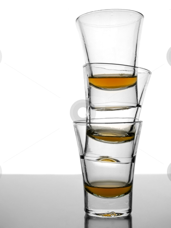 To use this stock image in your creative project, please select the size you need over to the right and click the "Add to Cart" button.
Your downloaded image will come with the Cutcaster watermark removed so don’t worry about the watermark you see on this page. Three shots of whiskey stock photo, A pile of three almost empty shots of whiskey on white background over gray floor. by Ignacio Gonzalez Prado