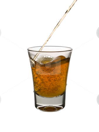 Shot of whisky Shot of whisky stock photo, Pouring a shot of whisky on white background. by Ignacio Gonzalez Prado