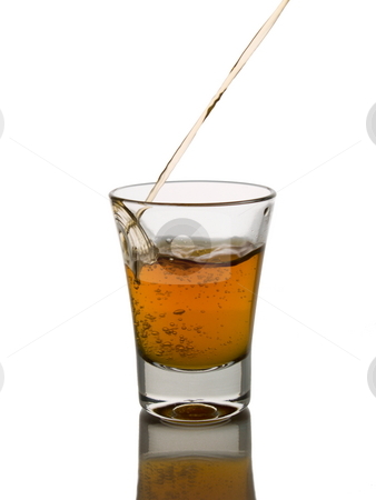 Shot of whisky Shot of whisky stock photo, Pouring a shot of whisky. by Ignacio Gonzalez Prado