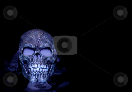 To use this stock image in your creative project, please select the size you need over to the right and click the "Add to Cart" button.
Your downloaded image will come with the Cutcaster watermark removed so don’t worry about the watermark you see on this page. Steaming skull stock photo, A Halloween prop skull with fog coming from it's eyes and nose. by Cora Reed