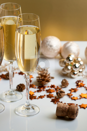 To use this stock image in your creative project, please select the size you need over to the right and click the "Add to Cart" button.
Your downloaded image will come with the Cutcaster watermark removed so don’t worry about the watermark you see on this page. Glasses of champagne stock photo, Three glasses of champagne, christmas balls and ornaments in front of golden background by Alexander Zschach