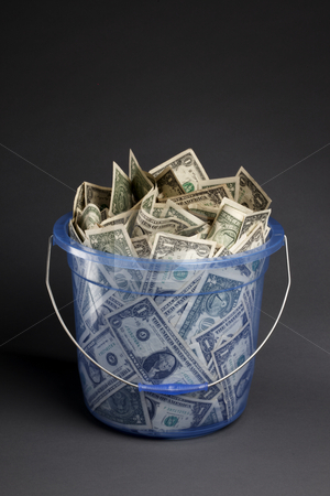 Bucket-O-Bucks Bucket-O-Bucks stock photo, Large blue transparent plastic bucket filled with dollar bills by James Barber