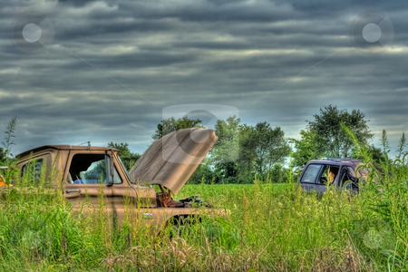 To use this stock image in your creative project, please select the size you need over to the right and click the "Add to Cart" button.
Your downloaded image will come with the Cutcaster watermark removed so don’t worry about the watermark you see on this page. Wrecked Vehicles in HDR stock photo, Old wrecked vehicles abandoned in field done in HDR by Dennis Crumrin