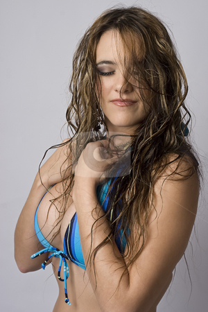 To use this stock image in your creative project, please select the size you need over to the right and click the "Add to Cart" button.
Your downloaded image will come with the Cutcaster watermark removed so don’t worry about the watermark you see on this page. Shy girl in bikini stock photo, Women wearing a strip blue bikini trying to hide herself by Yann Poirier