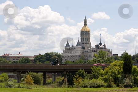 To use this stock image in your creative project, please select the size you need over to the right and click the "Add to Cart" button.
Your downloaded image will come with the Cutcaster watermark removed so don’t worry about the watermark you see on this page. Hartford Capital Building stock photo, The golden domed capitol building in Hartford Connecticut. by Todd Arena