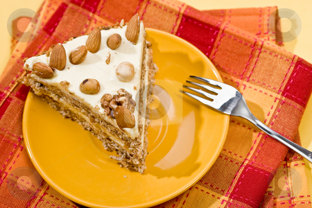 To use this stock image in your creative project, please select the size you need over to the right and click the "Add to Cart" button.
Your downloaded image will come with the Cutcaster watermark removed so don’t worry about the watermark you see on this page. Nut cake stock photo, Cake with almonds and nut on the yellow plate by Gennady Kravetsky
