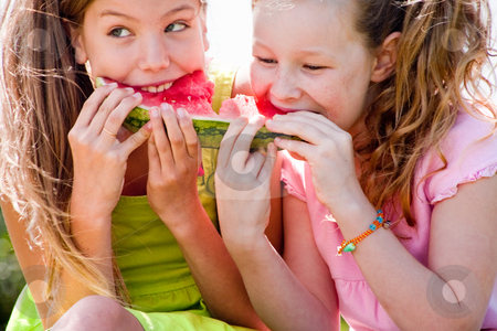 Watermelon fight Watermelon fight stock photo, Teenagers having a great time in the park by Frenk and Danielle Kaufmann