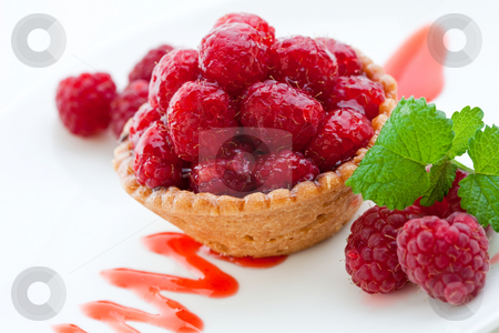 To use this stock image in your creative project, please select the size you need over to the right and click the "Add to Cart" button.
Your downloaded image will come with the Cutcaster watermark removed so don’t worry about the watermark you see on this page. Delicious fresh raspberry tart stock photo, Delicious raspberry tart with home grown raspberries and a mint leaf by Robert Anthony