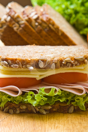 To use this stock image in your creative project, please select the size you need over to the right and click the "Add to Cart" button.
Your downloaded image will come with the Cutcaster watermark removed so don’t worry about the watermark you see on this page. Fresh wholemeal sandwich stock photo, Fresh wholemeal cheese and ham sandwich by Robert Anthony