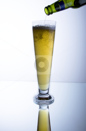 To use this stock image in your creative project, please select the size you need over to the right and click the "Add to Cart" button.
Your downloaded image will come with the Cutcaster watermark removed so don’t worry about the watermark you see on this page. Beer stock photo, Pouring a glass of beer with reflection by Jandrie Lombard
