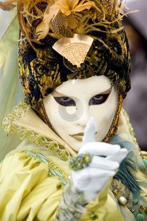 Follow my finger Follow my finger stock photo, A venetian women in a yellow costume with strong eye contact by Robert Anthony