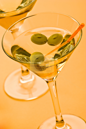 To use this stock image in your creative project, please select the size you need over to the right and click the "Add to Cart" button.
Your downloaded image will come with the Cutcaster watermark removed so don’t worry about the watermark you see on this page. Martini stock photo, Two bocal of martini with olive over yellow by Gennady Kravetsky