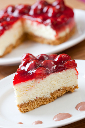 To use this stock image in your creative project, please select the size you need over to the right and click the "Add to Cart" button.
Your downloaded image will come with the Cutcaster watermark removed so don’t worry about the watermark you see on this page. Slice of delicious strawberry cheese cake stock photo, Slice of delicious strawberry cheese cake with a cake in the background by Robert Anthony