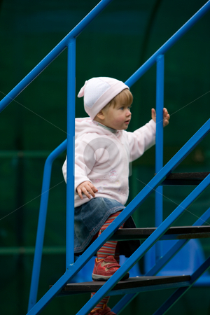 To use this stock image in your creative project, please select the size you need over to the right and click the "Add to Cart" button.
Your downloaded image will come with the Cutcaster watermark removed so don’t worry about the watermark you see on this page. Little girl stock photo, People series: little girl get up on stairs by Gennady Kravetsky