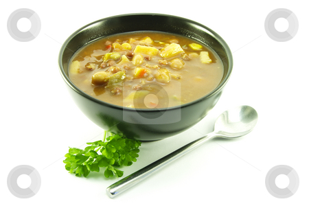 Vegetable Soup in a Black Bowl Vegetable Soup in a Black Bowl stock photo, Hot chunky vegetable soup with a sprig of parsley and a spoon in a small black bowl on a white background by Keith Wilson
