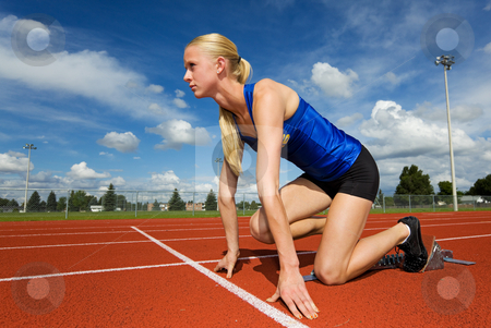 Ready to race Ready to race stock photo, A teen athlete ready to race in the starting blocks by Steve Mcsweeny