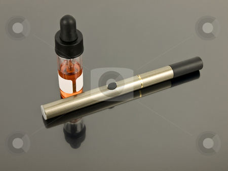 To use this stock image in your creative project, please select the size you need over to the right and click the "Add to Cart" button.
Your downloaded image will come with the Cutcaster watermark removed so don’t worry about the watermark you see on this page. Electronic Cigarette stock photo, Electronic Cigarette with e-juice on silver background by John Teeter