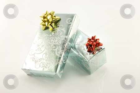 Two Silver Wrapped Gifts Two Silver Wrapped Gifts stock photo, Two shiny silver wrapped gifts on a reflective white background by Keith Wilson
