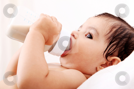 To use this stock image in your creative project, please select the size you need over to the right and click the "Add to Cart" button.
Your downloaded image will come with the Cutcaster watermark removed so don’t worry about the watermark you see on this page. Baby's bottle stock photo, Baby drinking milk of her bottle. White background by Giuseppe Ramos